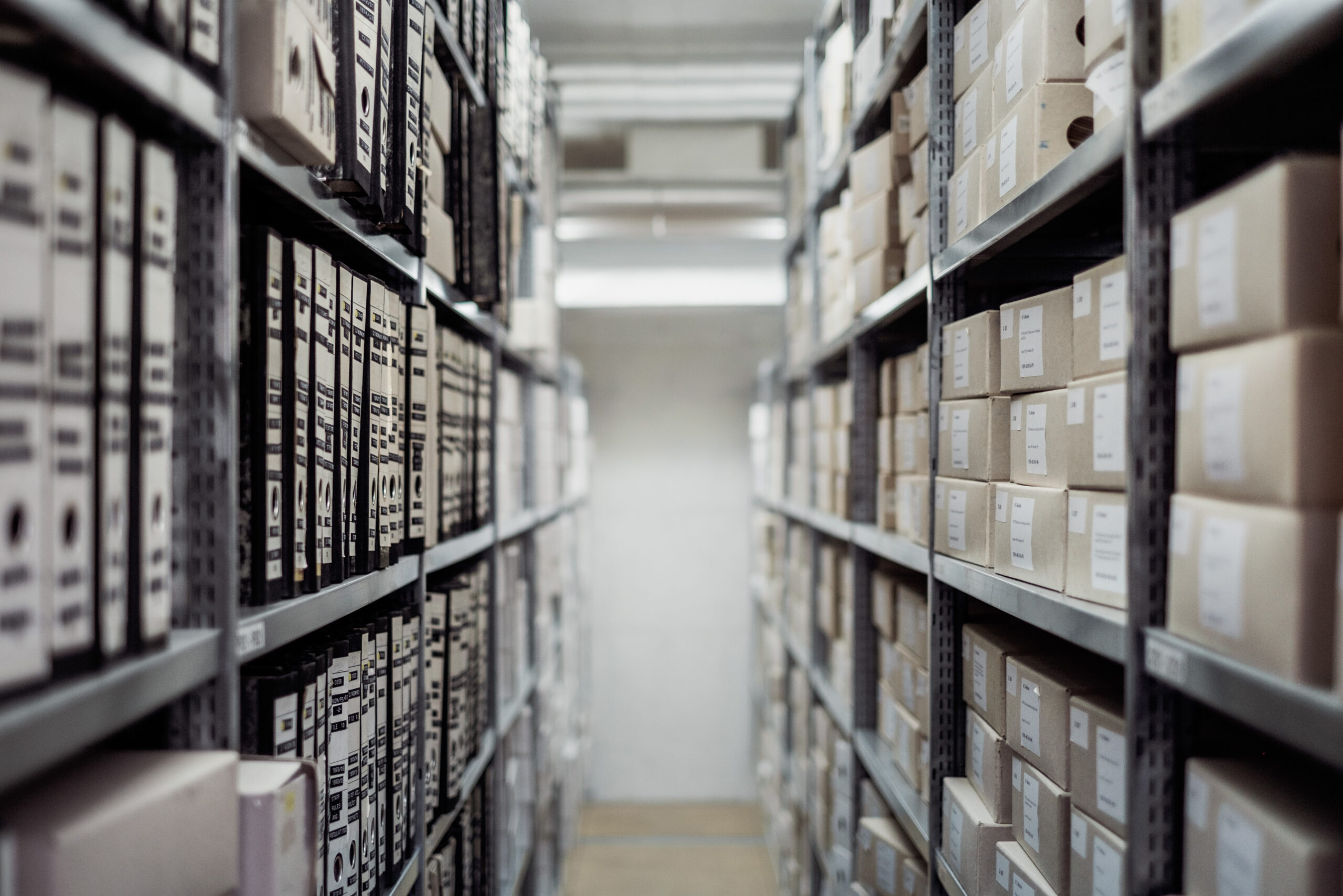 Canva - Archives and Boxes in Warehouse
